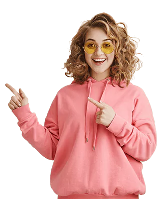 excited stylish curly haired girl in sunglasses pointing right showing way
